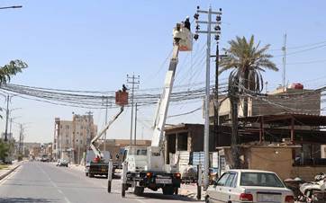 Electricity crews from Iraq’s Ministry of Electricity carry out repairs on the national power grid in the southern province of Karbala on July 21, 2025. File photo: Ministry of Electricity/Facebook